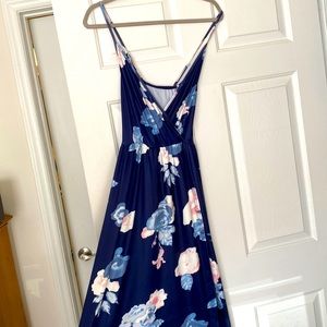 Navy floral maxi wrap dress with adjustable straps.